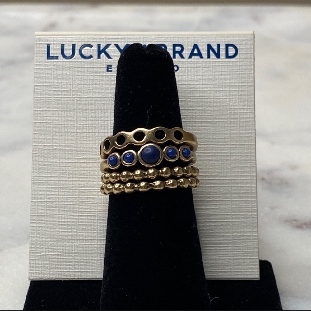 NWT LUCKY BRAND Set of 4 Gold Tone Stackable Rings Blue Stone Accent Size 7 - Picture 2 of 5